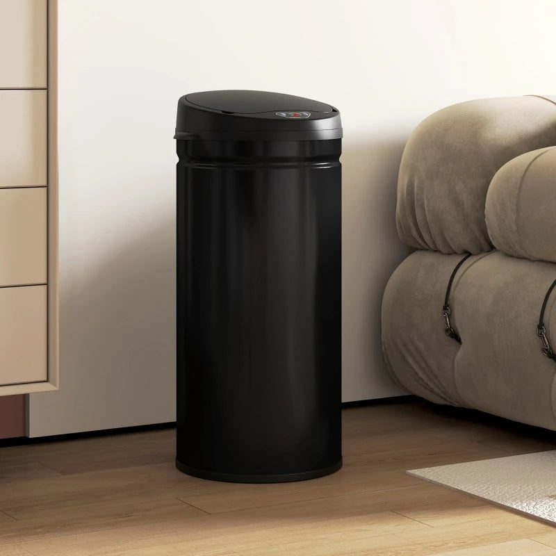 Poubelle automatique noire 42L dans un salon moderne